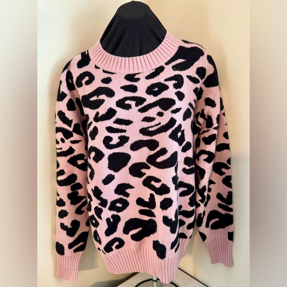 Super cute Pink & Black cow print sweater.